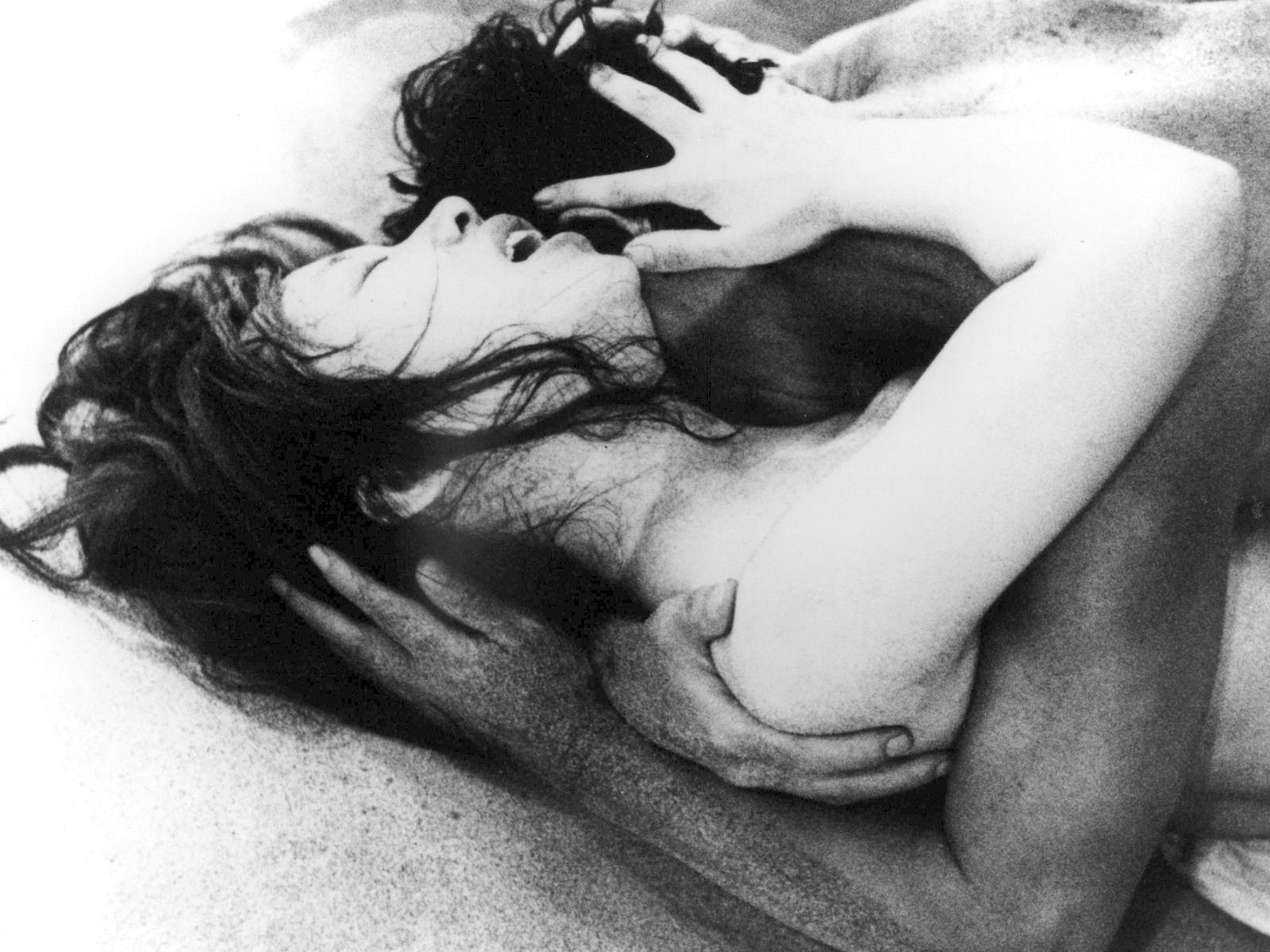 Black and white image of two figures embracing