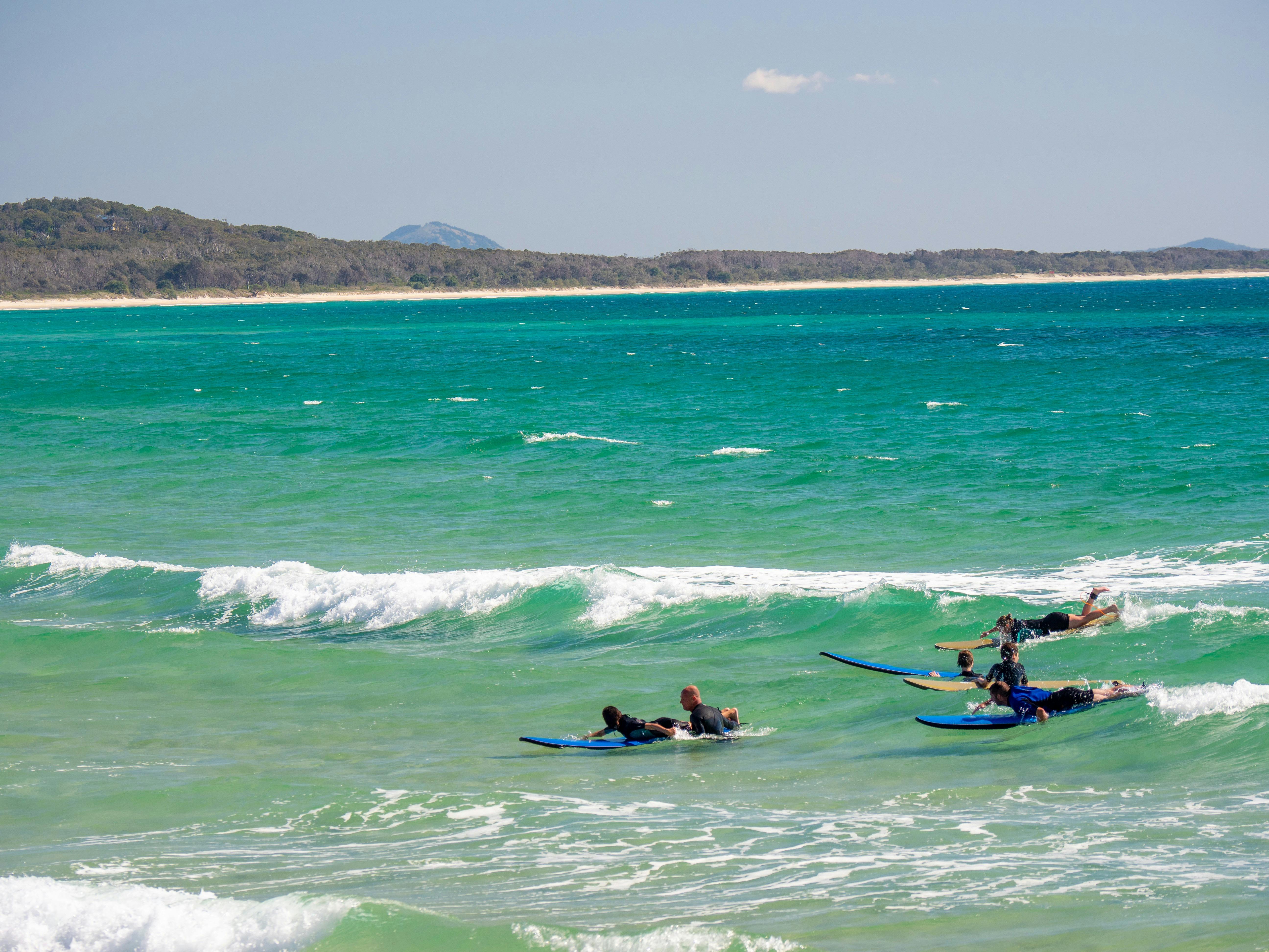 People surfing at Noosa Beach