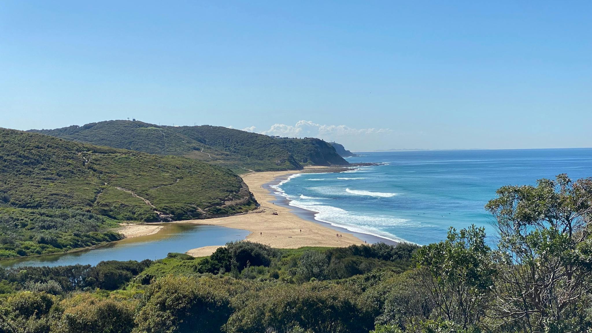 A view of forests, a lagoon and a beach