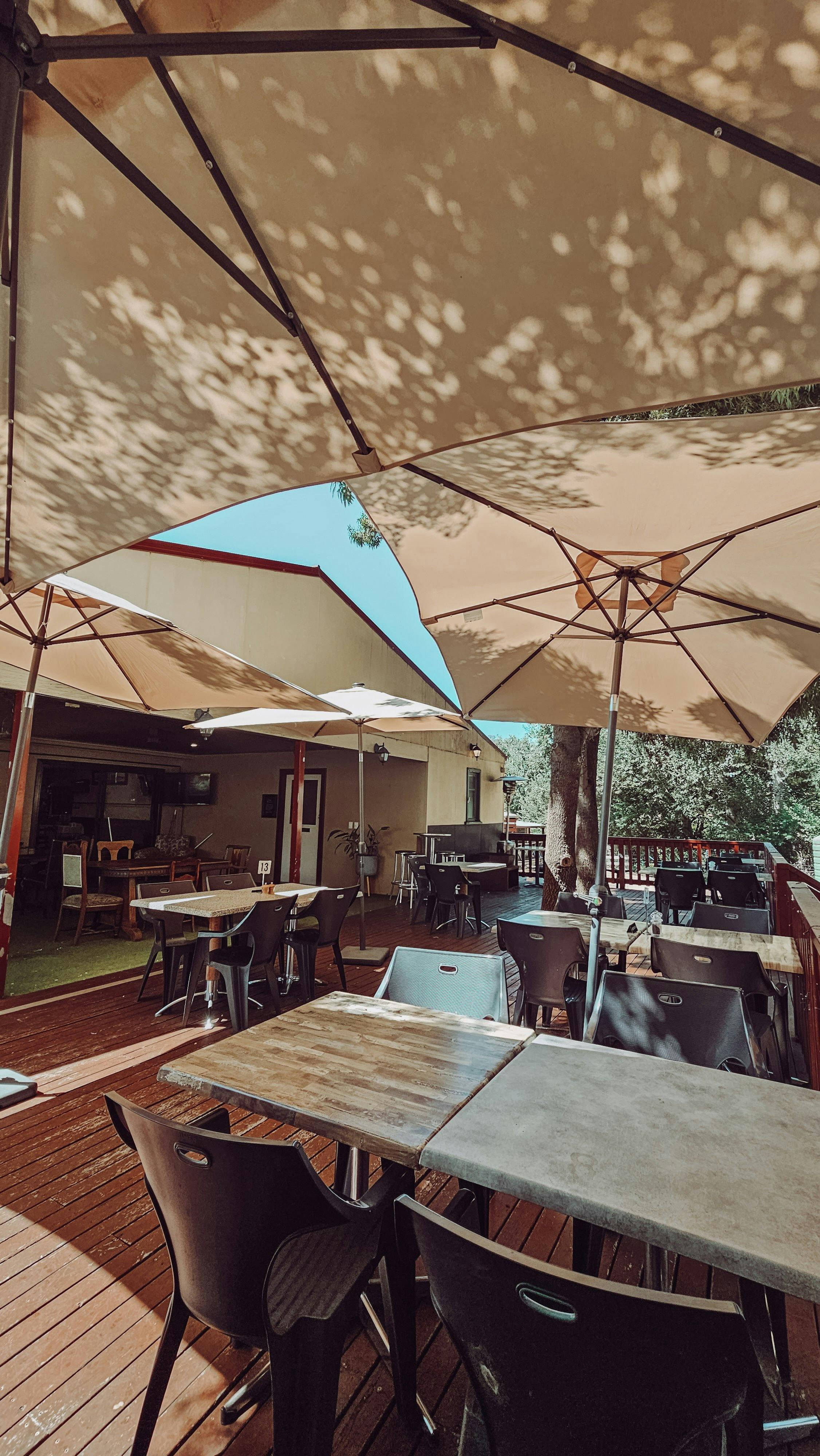 Back deck dining area with tables and chairs