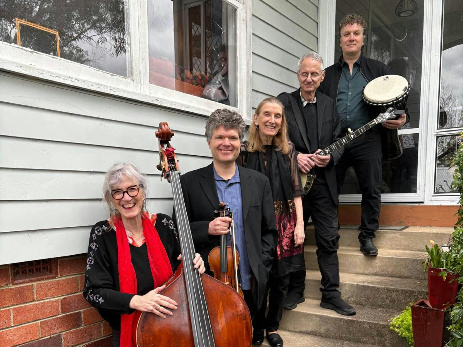 Musicians Ann Palumbo, Paul Laszlo, Jane Andino, James Gastineau-Hills, and Dion Palumbo.