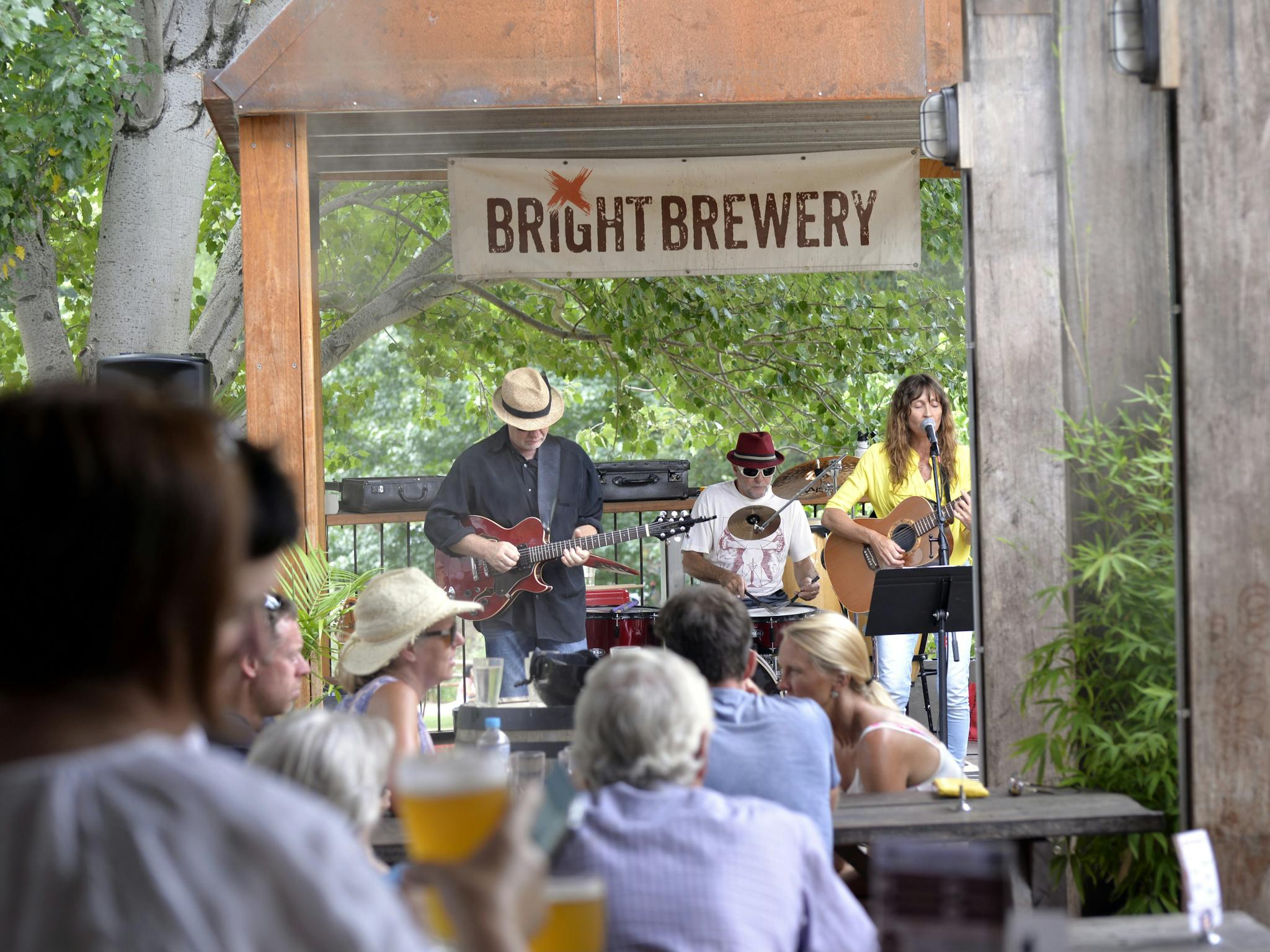 Onlookers watch a band play at Bright Brewery