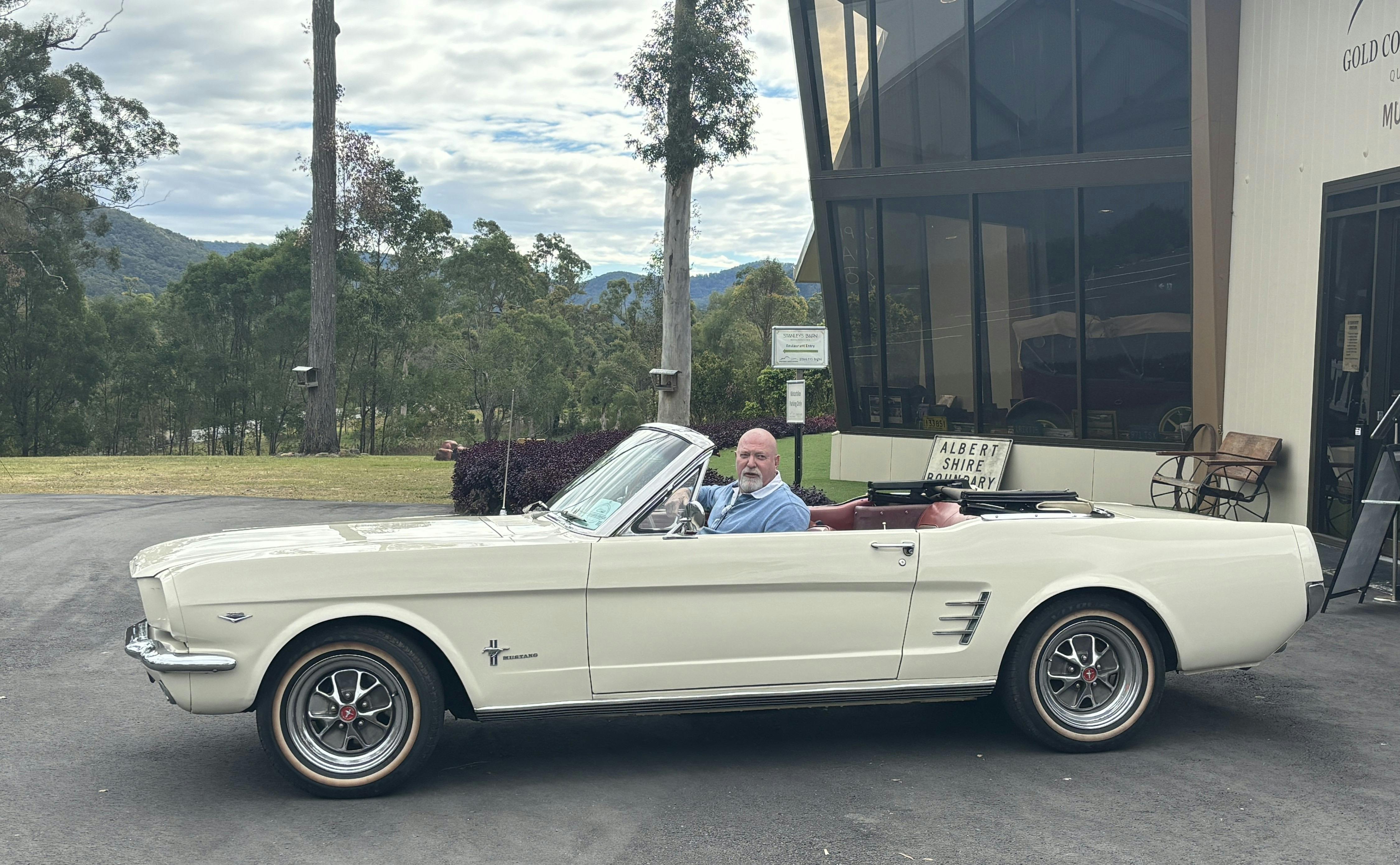 Cruising in a vintage convertible mustang