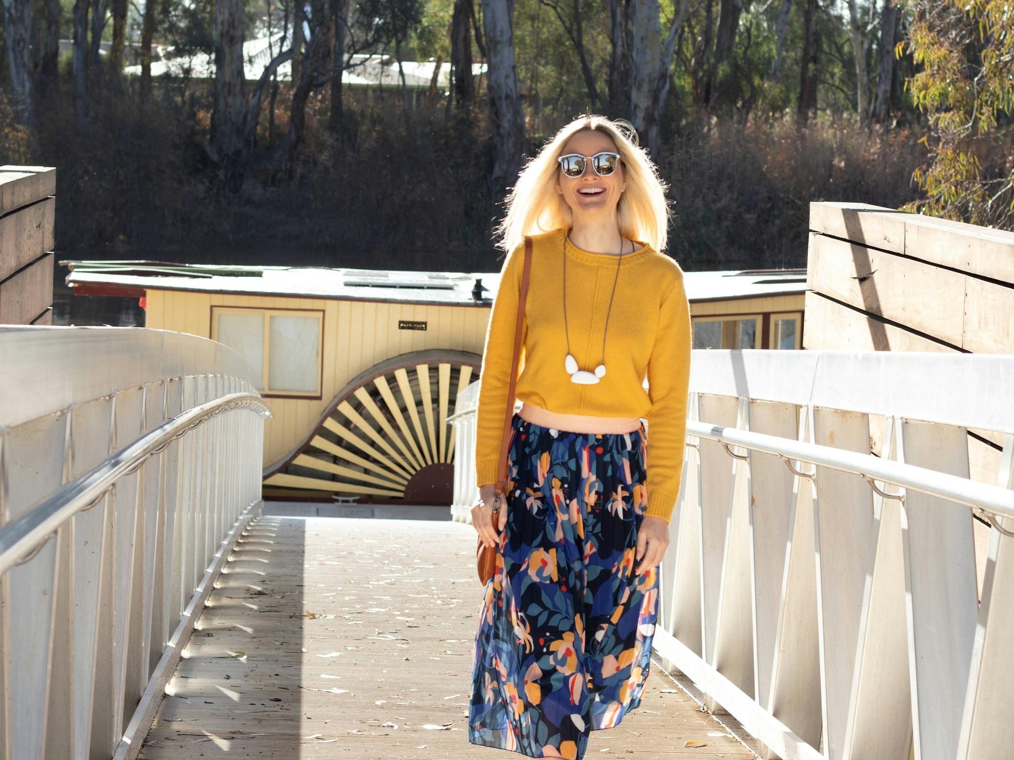 Visitor walking up the walkway from the floating pontoon of the Koondrook Wharf