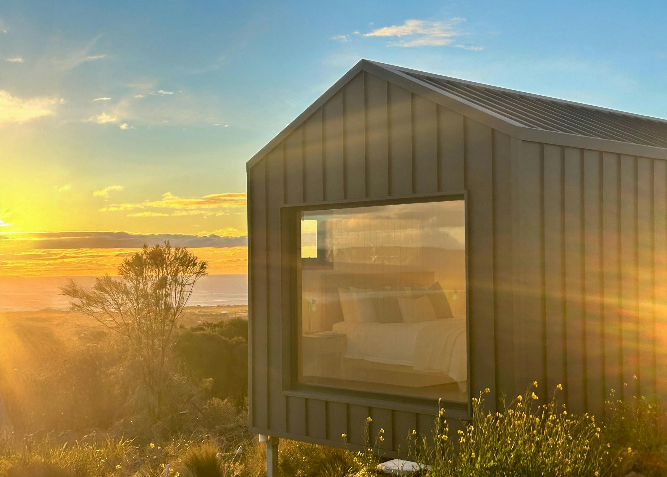 Sunset at The George Tasmania Eco-Pod Accommodation with ocean views