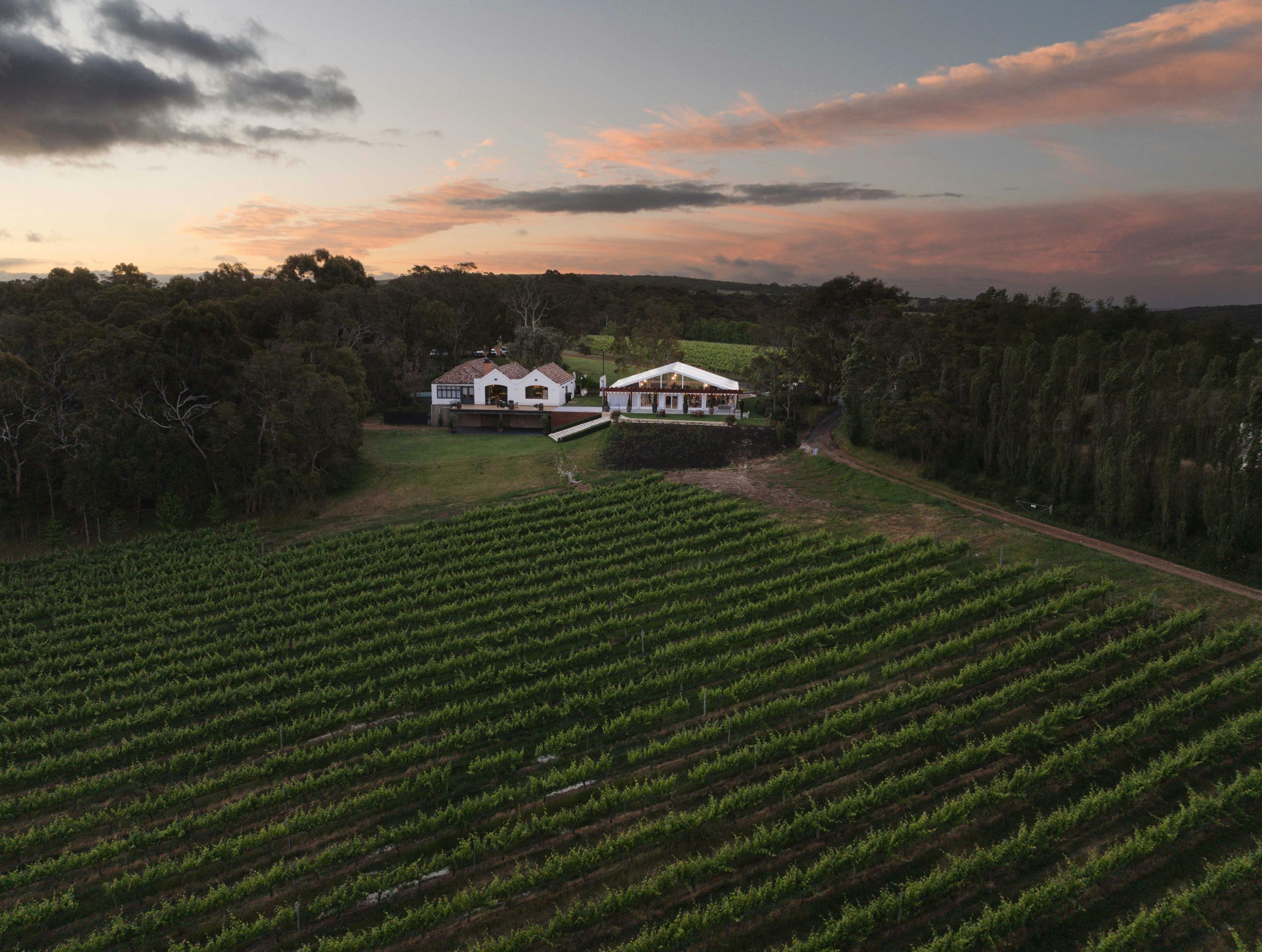 Credaro Estate Cellar Door at Yallingup, overlooking the back of venue towards a setting sun in west