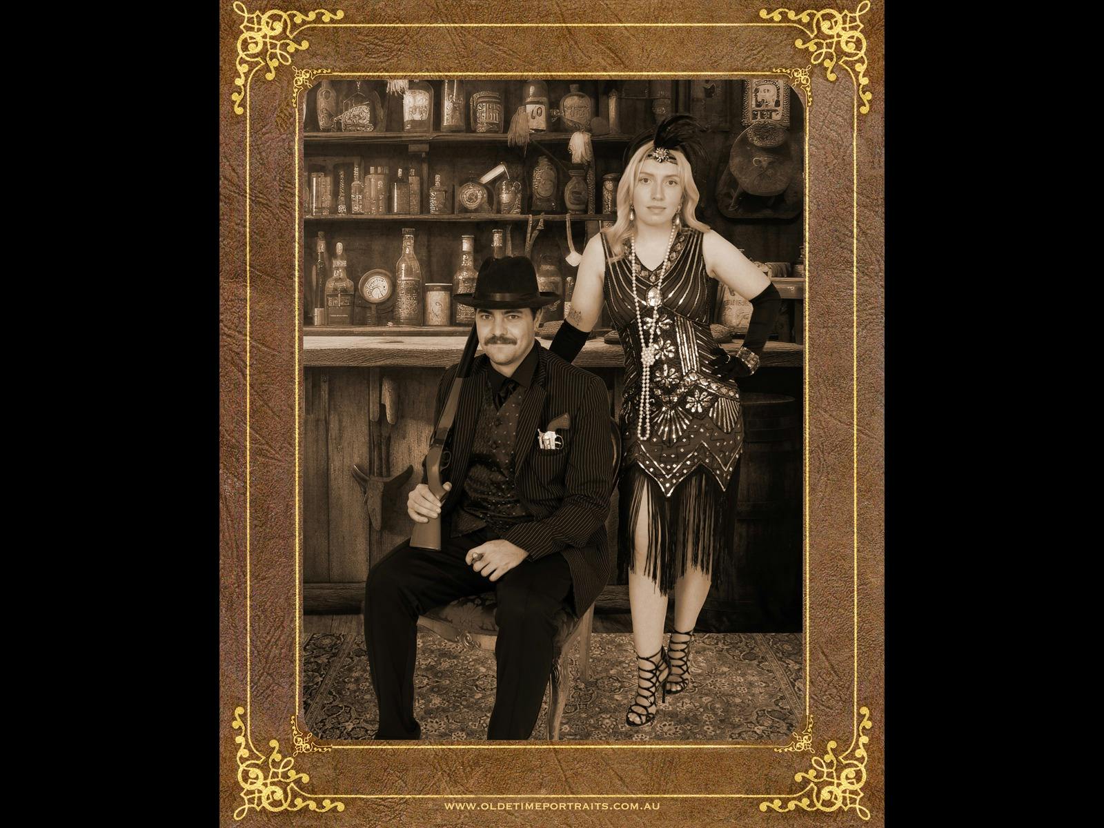a couple in gangster suit and 1920s beaded gown with saloon bar backdrop