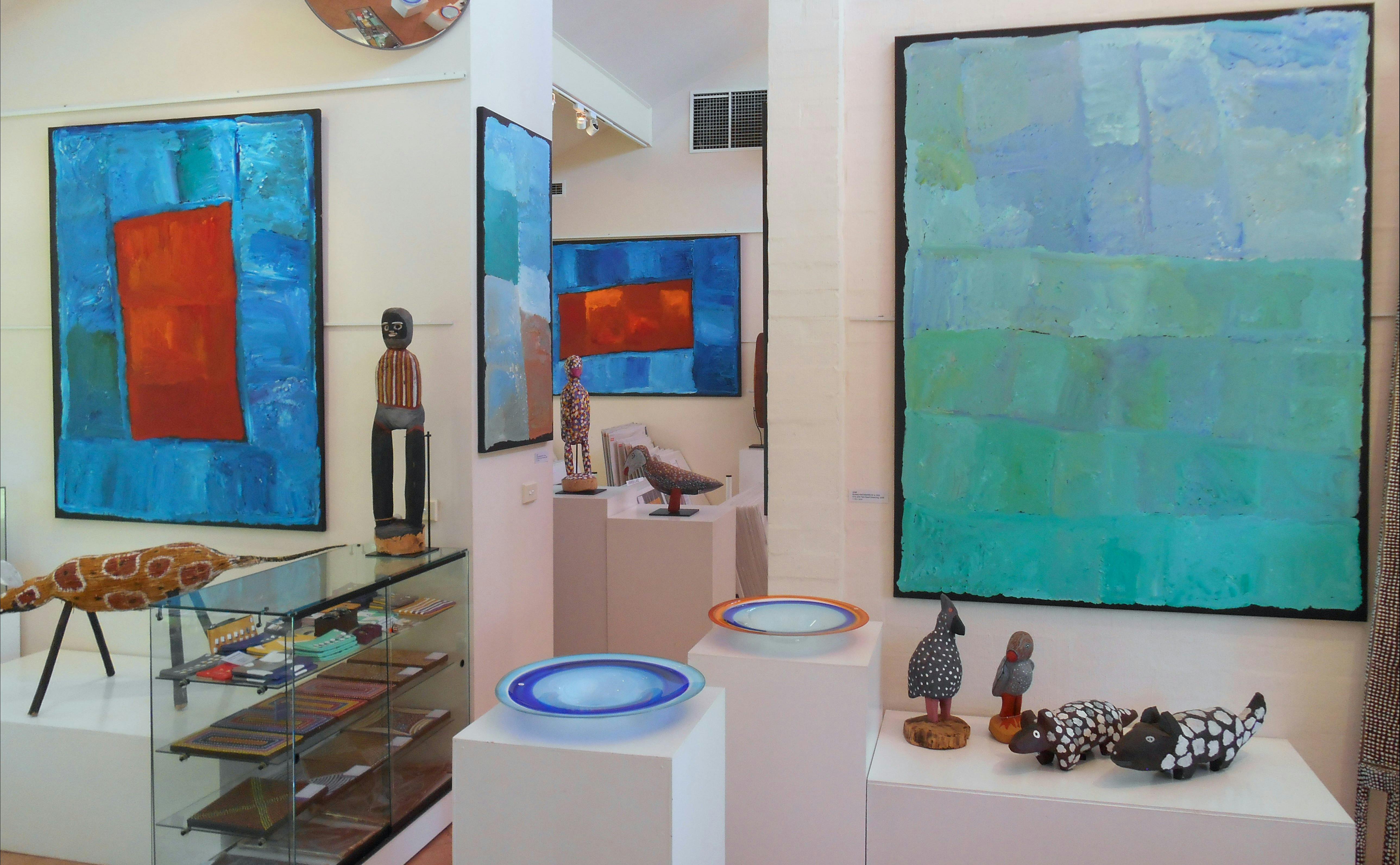 Large, colourful paintings by Kubbitji Kngwarreye on exhibition at Aboriginal Dreamings Gallery