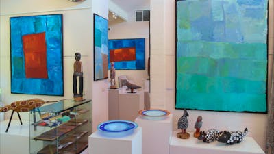 Large, colourful paintings by Kubbitji Kngwarreye on exhibition at Aboriginal Dreamings Gallery