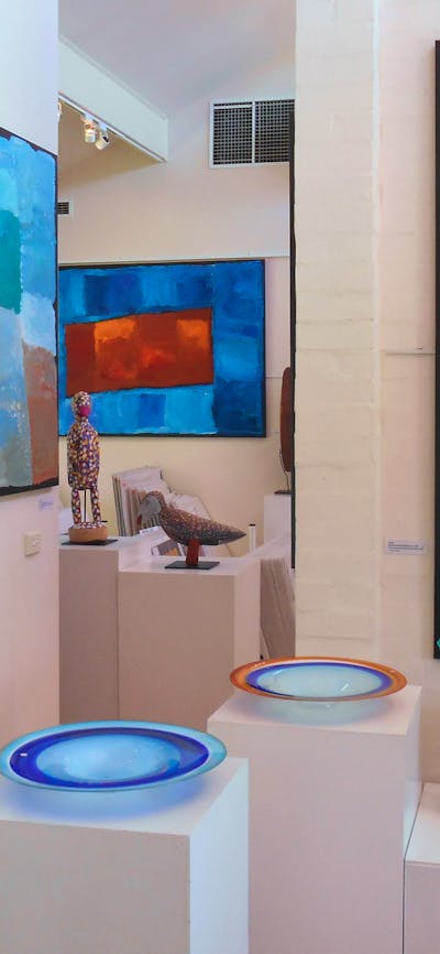 Large, colourful paintings by Kubbitji Kngwarreye on exhibition at Aboriginal Dreamings Gallery