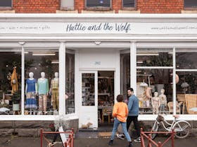 couple entering shop front of Hattie and the Wolf