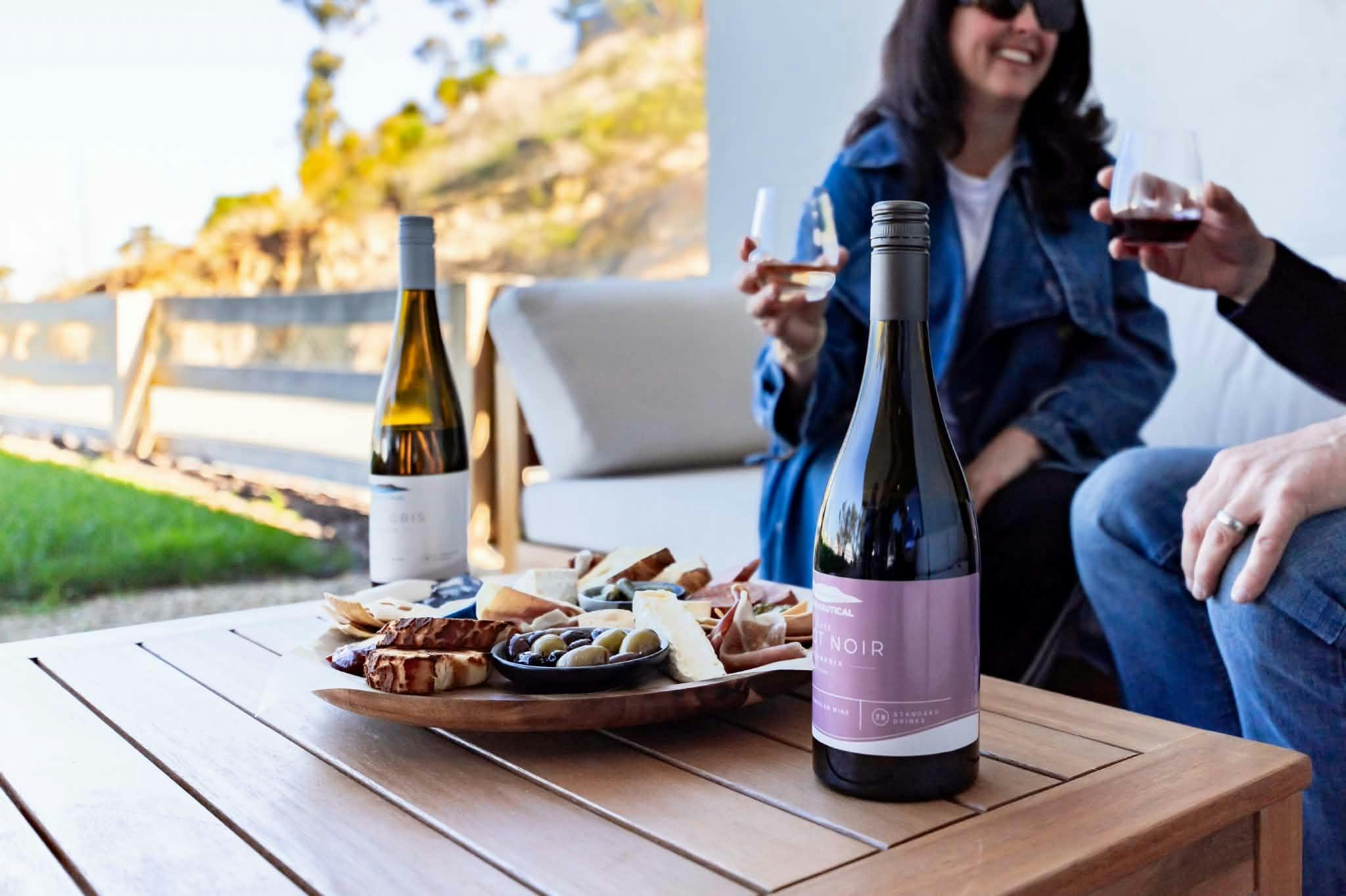 Customer enjoying a grazing board and wine