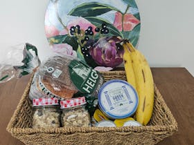 Coonawarra Experiences - Breakfast basket with muesli, yoghurt, bananas, and local condiments