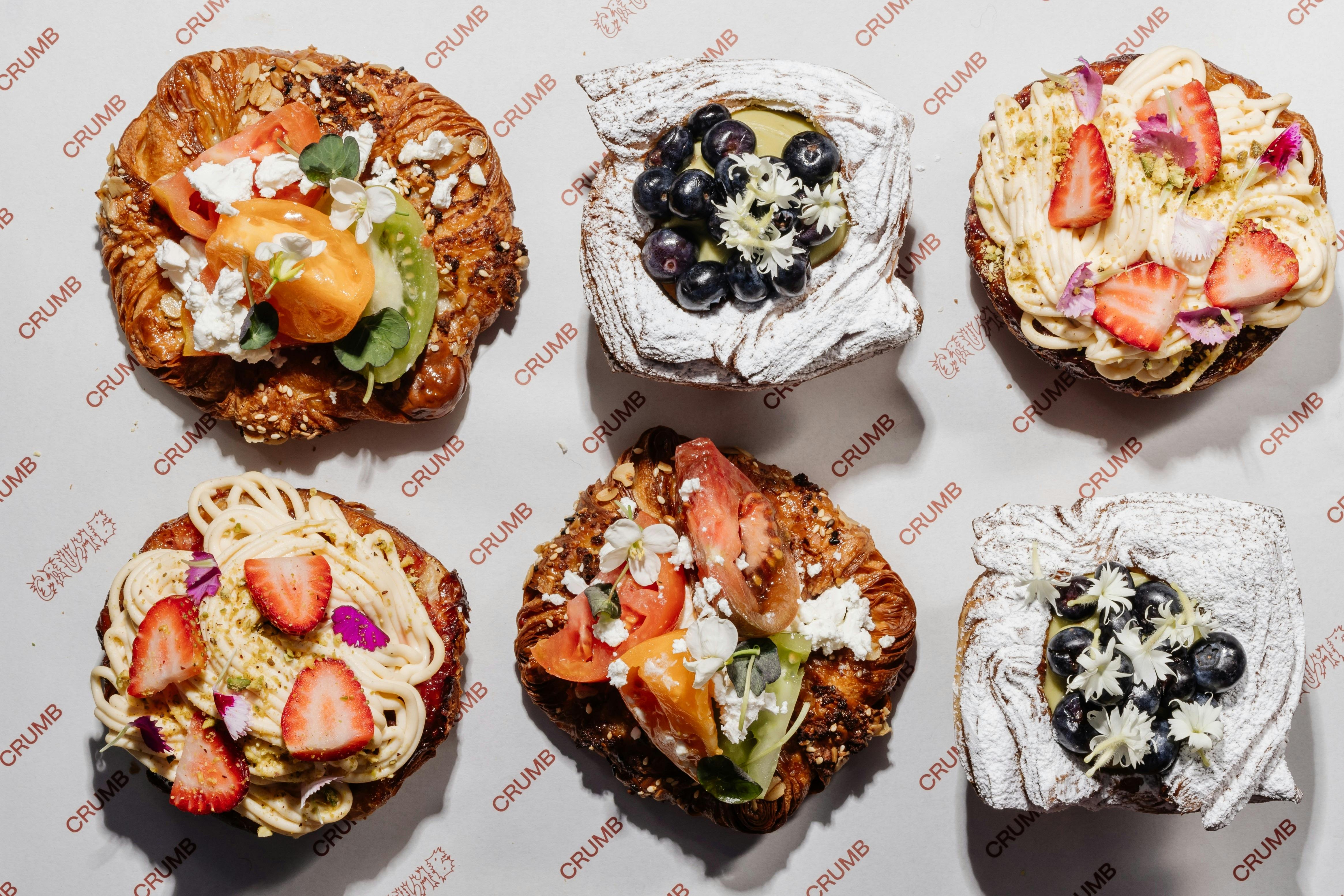 Assortment of colourful pastries on a tray at Crumb