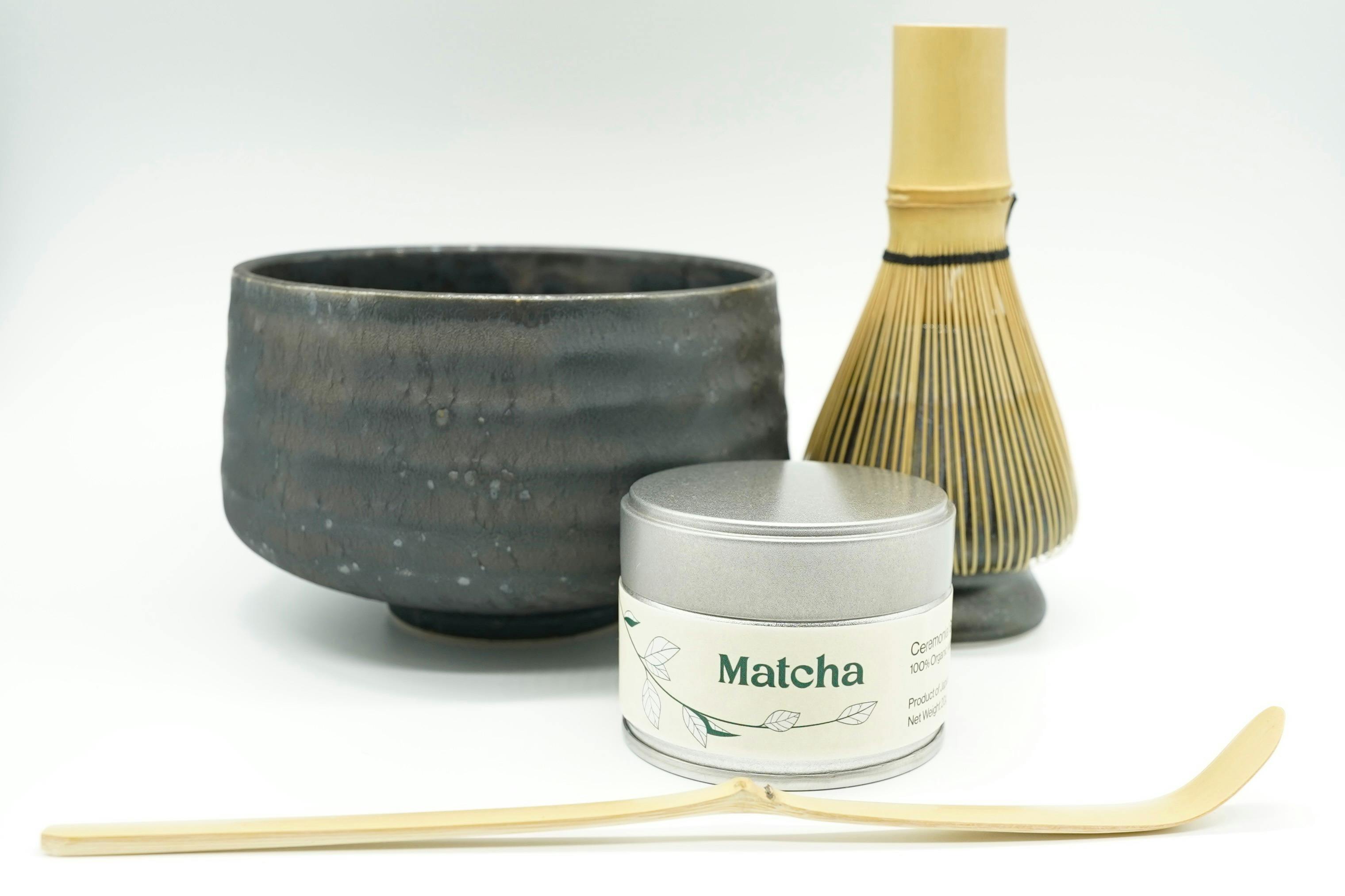Japanese matcha bowl, bamboo whisk, bamboo scoop and a tin of ceremonial organic matcha