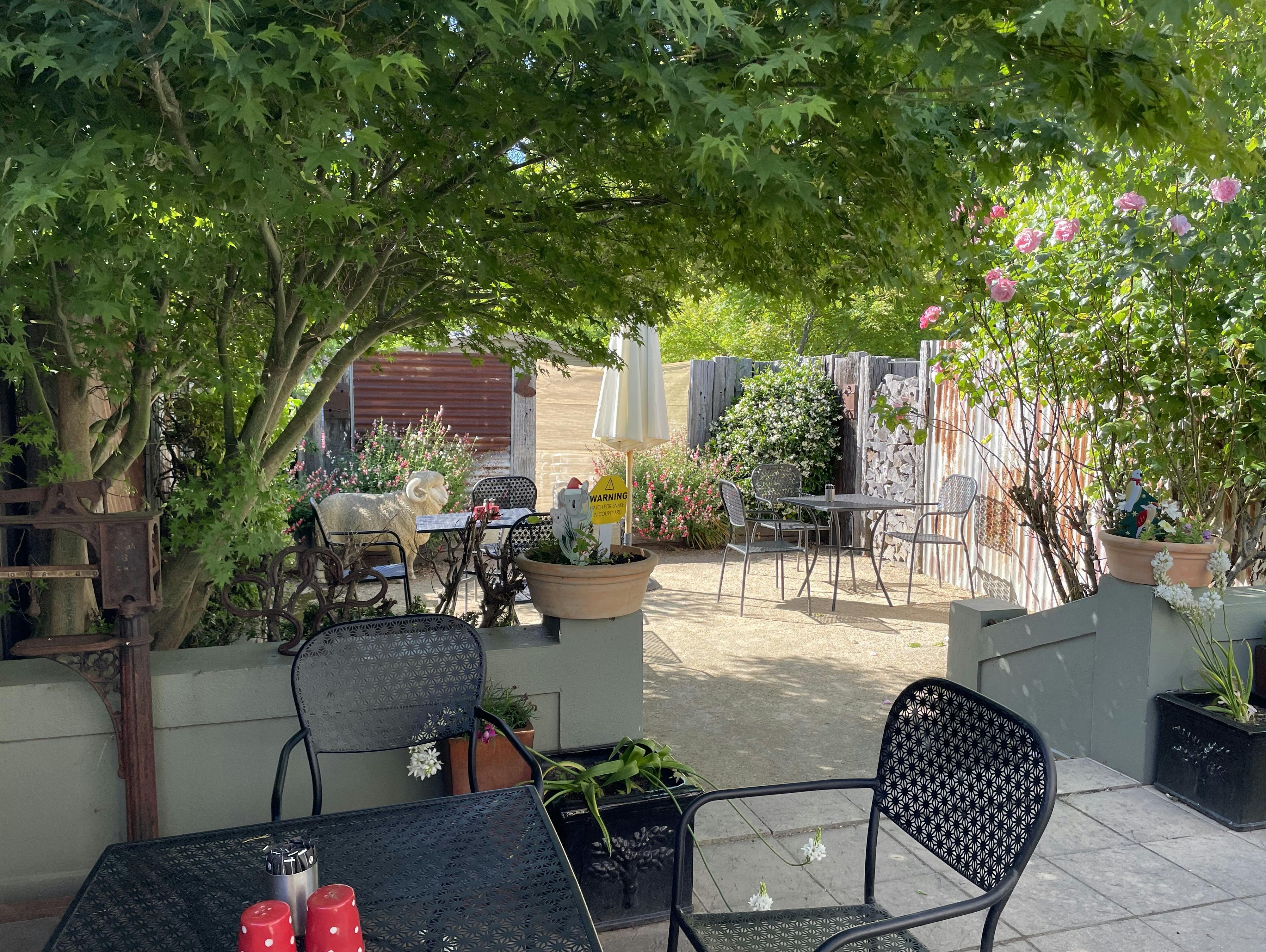 Courtyard with tables and chairs at Merino Café, Gunning.