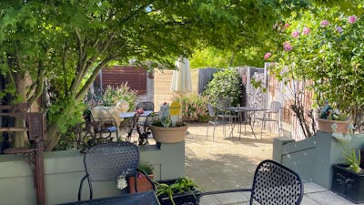 Courtyard with tables and chairs at Merino Café, Gunning.