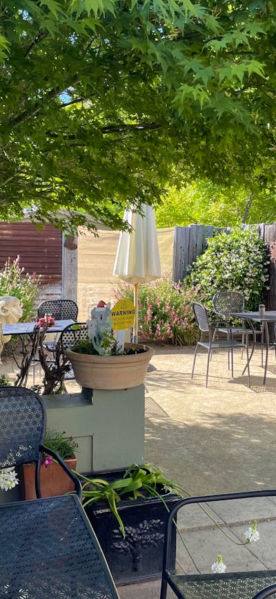 Courtyard with tables and chairs at Merino Café, Gunning.