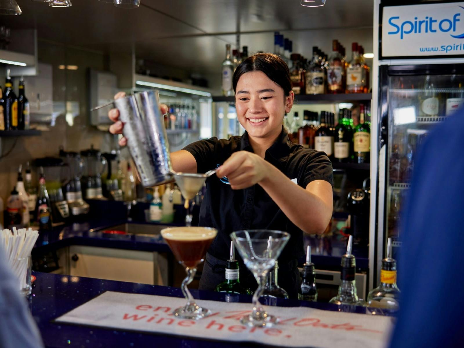 Staff making cocktails on Spirit of Cairns