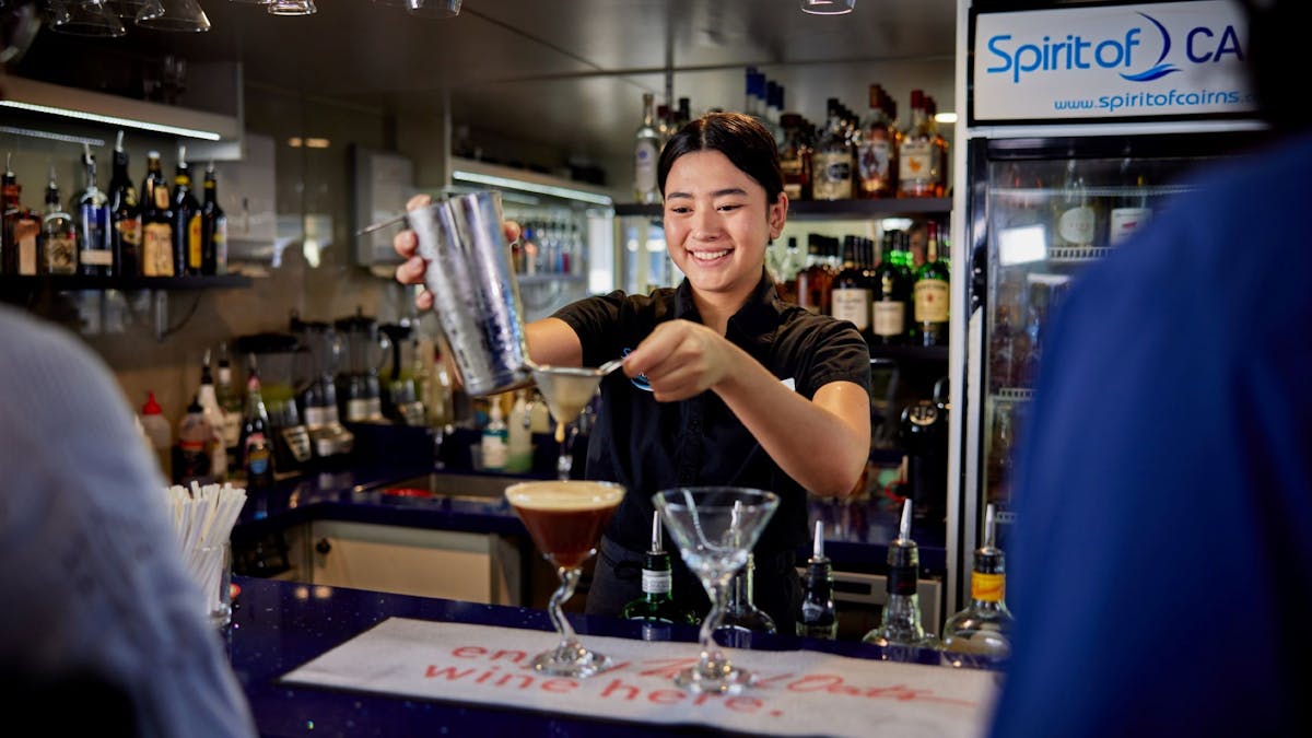 Staff making cocktails on Spirit of Cairns