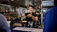 Staff making cocktails on Spirit of Cairns