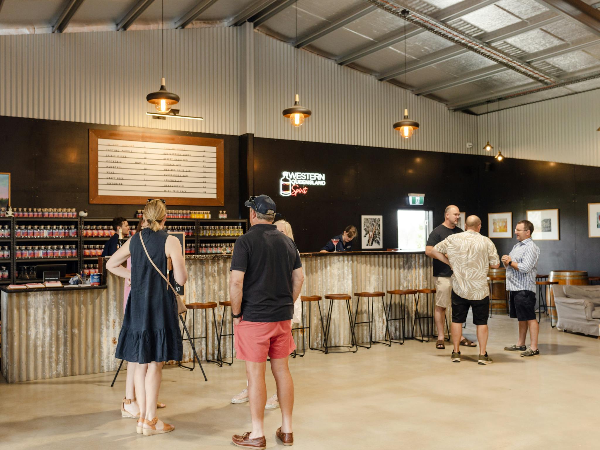 Guests gather inside the Western Queensland Spirit cellar door Guests gather inside the Western Queensland Spirit cellar door