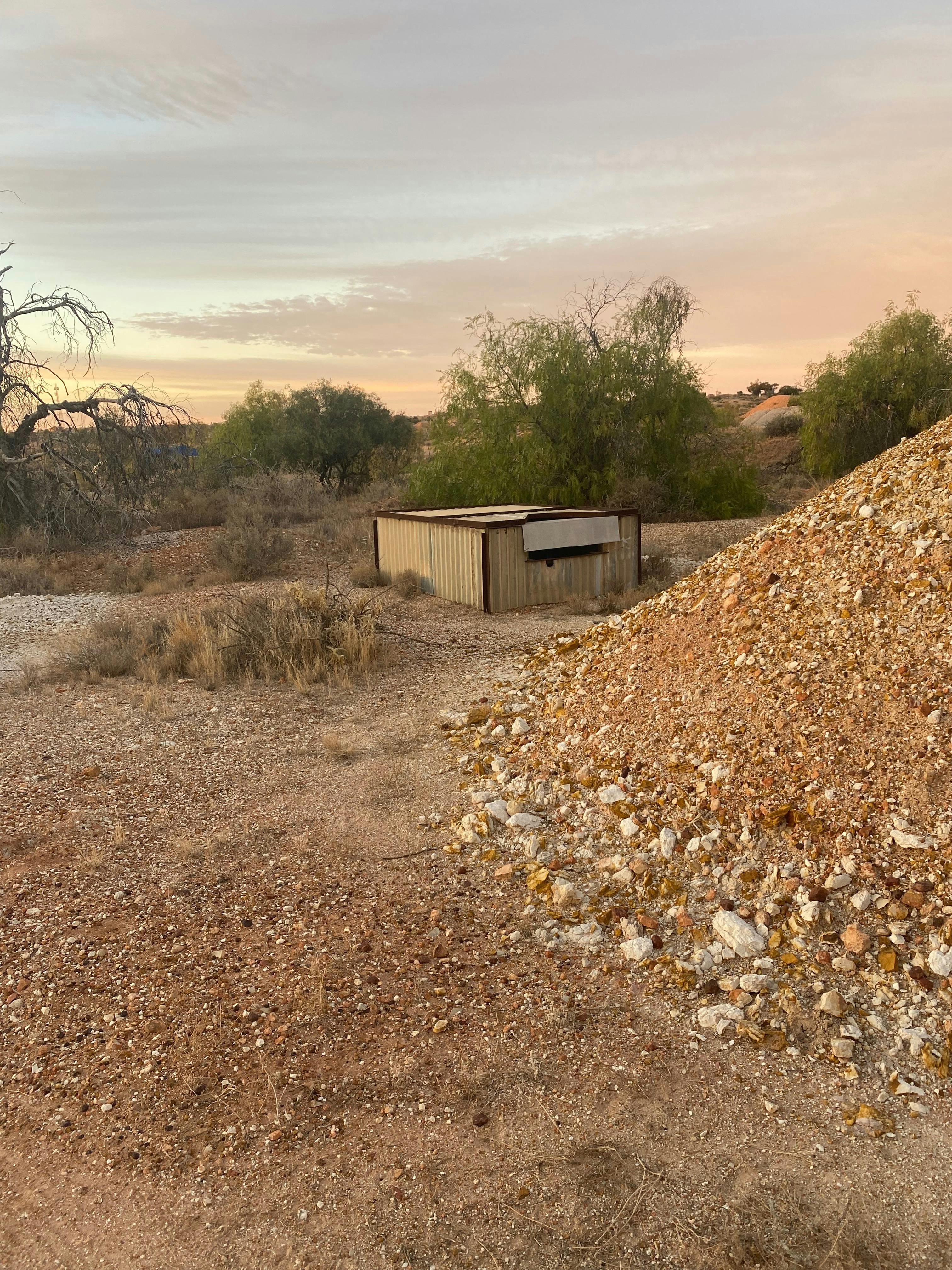 Mine shafts litter the field we see many as we drive through.
