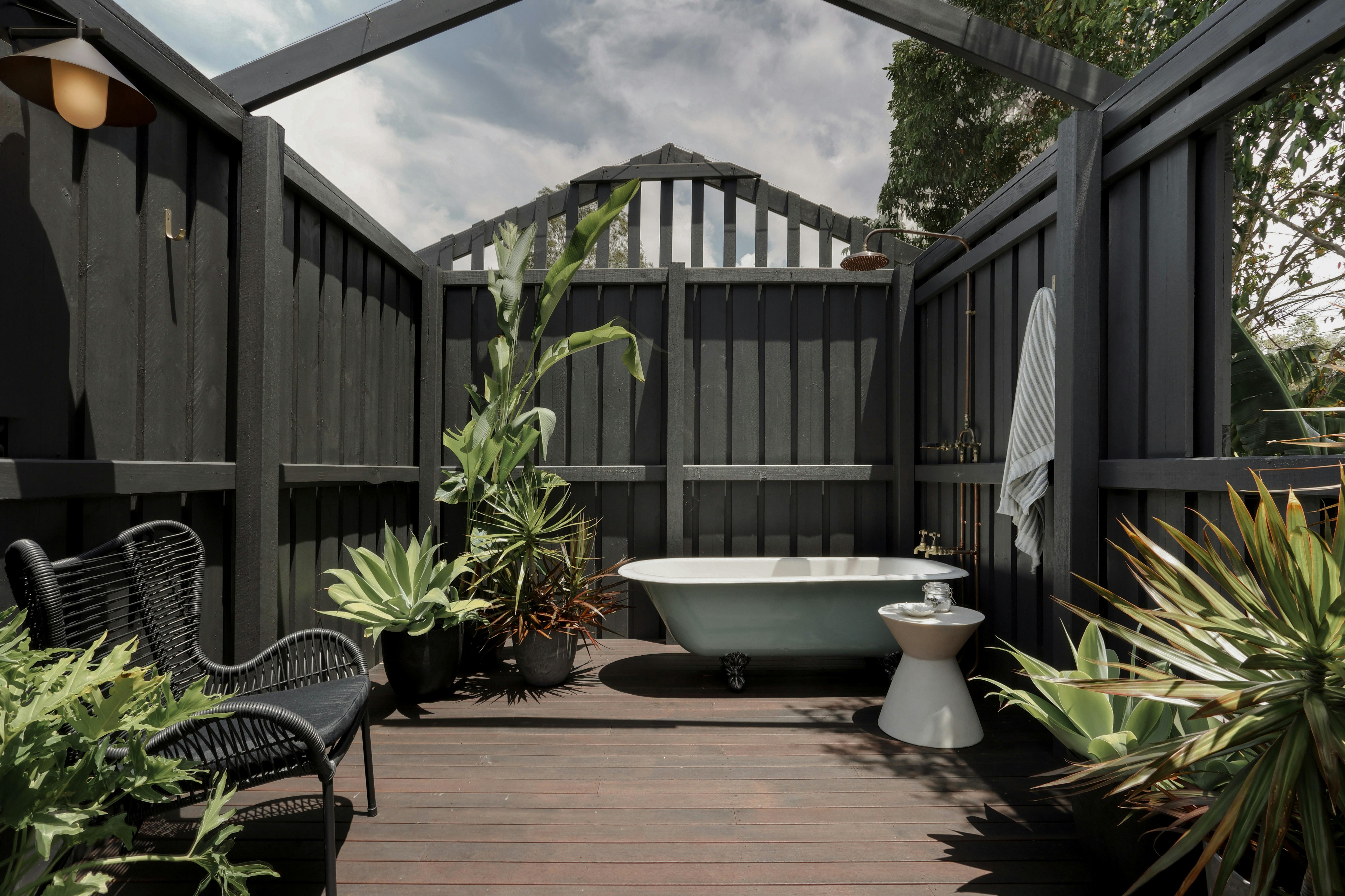 Outdoor bath house in The Acreage