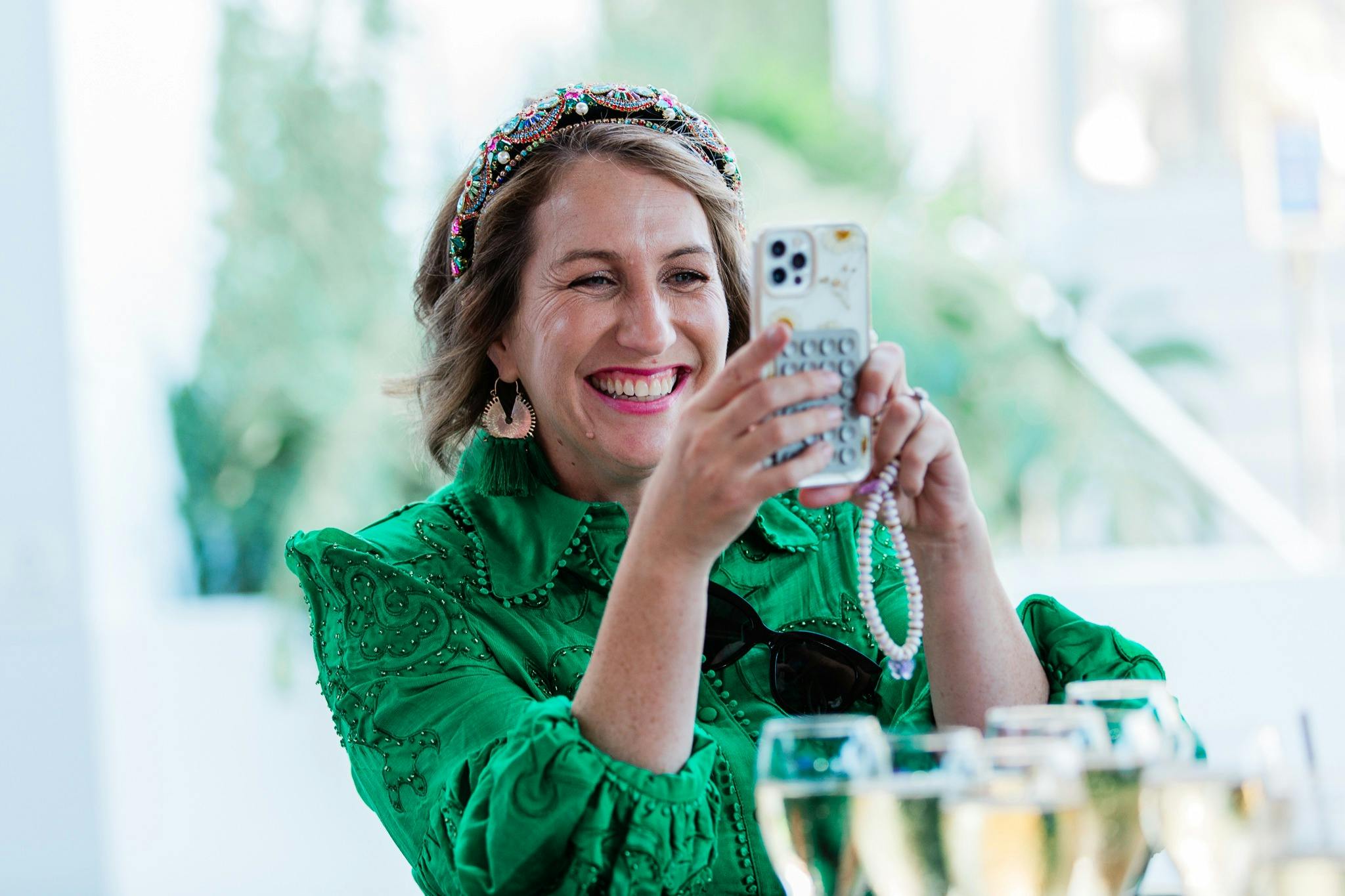 Lady taking a picture at Melbourne Cup