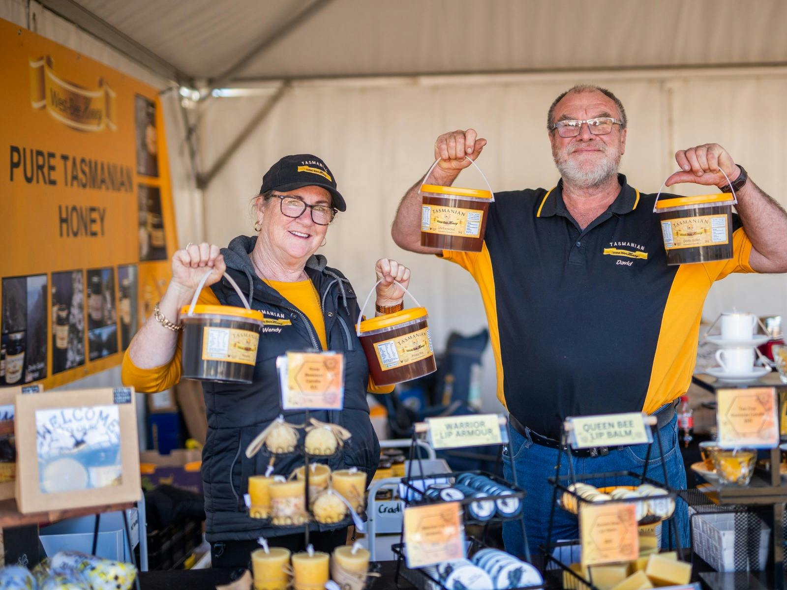 A Tasmanian honey stall displays golden honey.