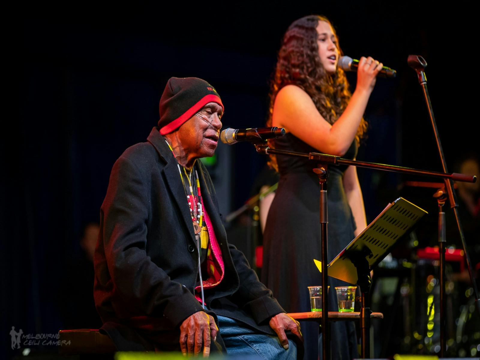 Uncle Archie Roach and young singer-songwriter Layla Barnett perform on stage