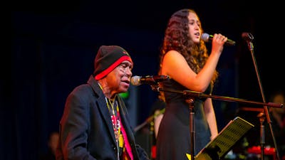 Uncle Archie Roach and young singer-songwriter Layla Barnett perform on stage