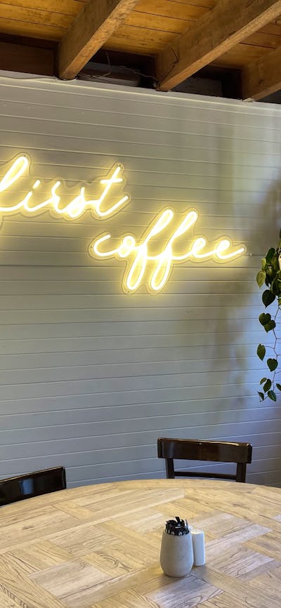 Sign which says ' But first coffee', inside Merino Cafe, Gunning,