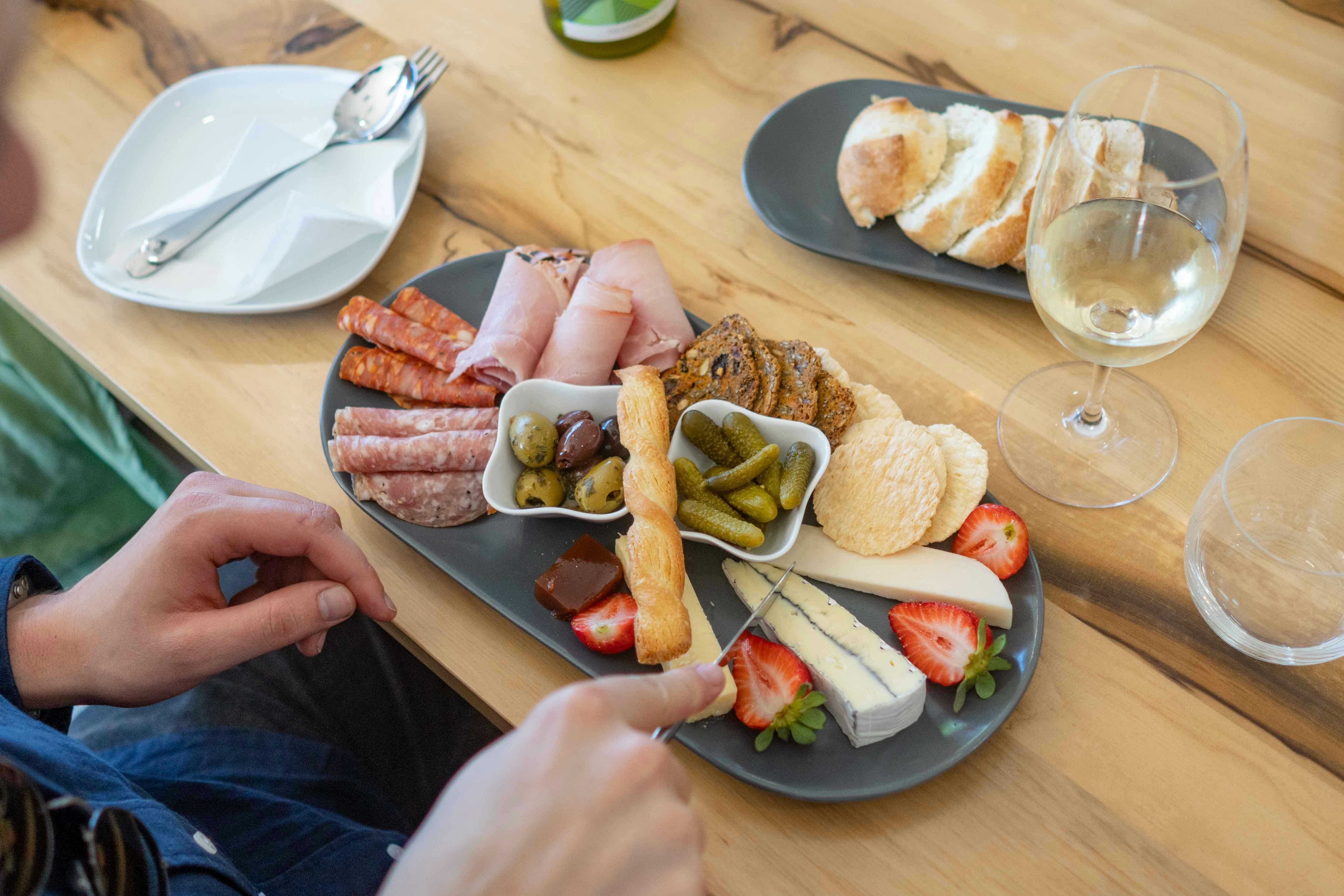 Rambling tour group enjoying wine tasting and a grazing platter at Silver Spoon Estate in Heathcote
