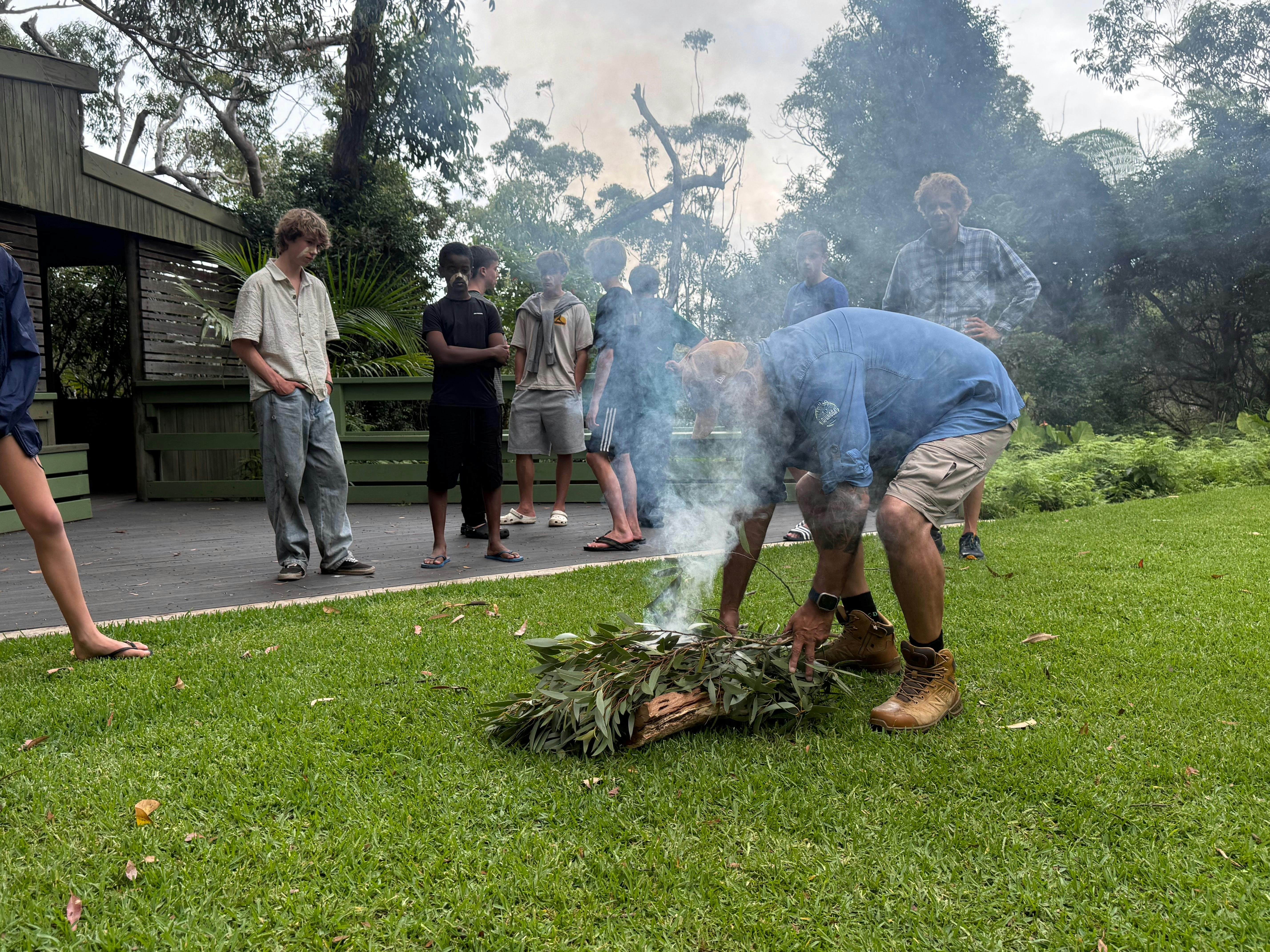 Aboriginal Traditional Owner starting a smoking ceremony