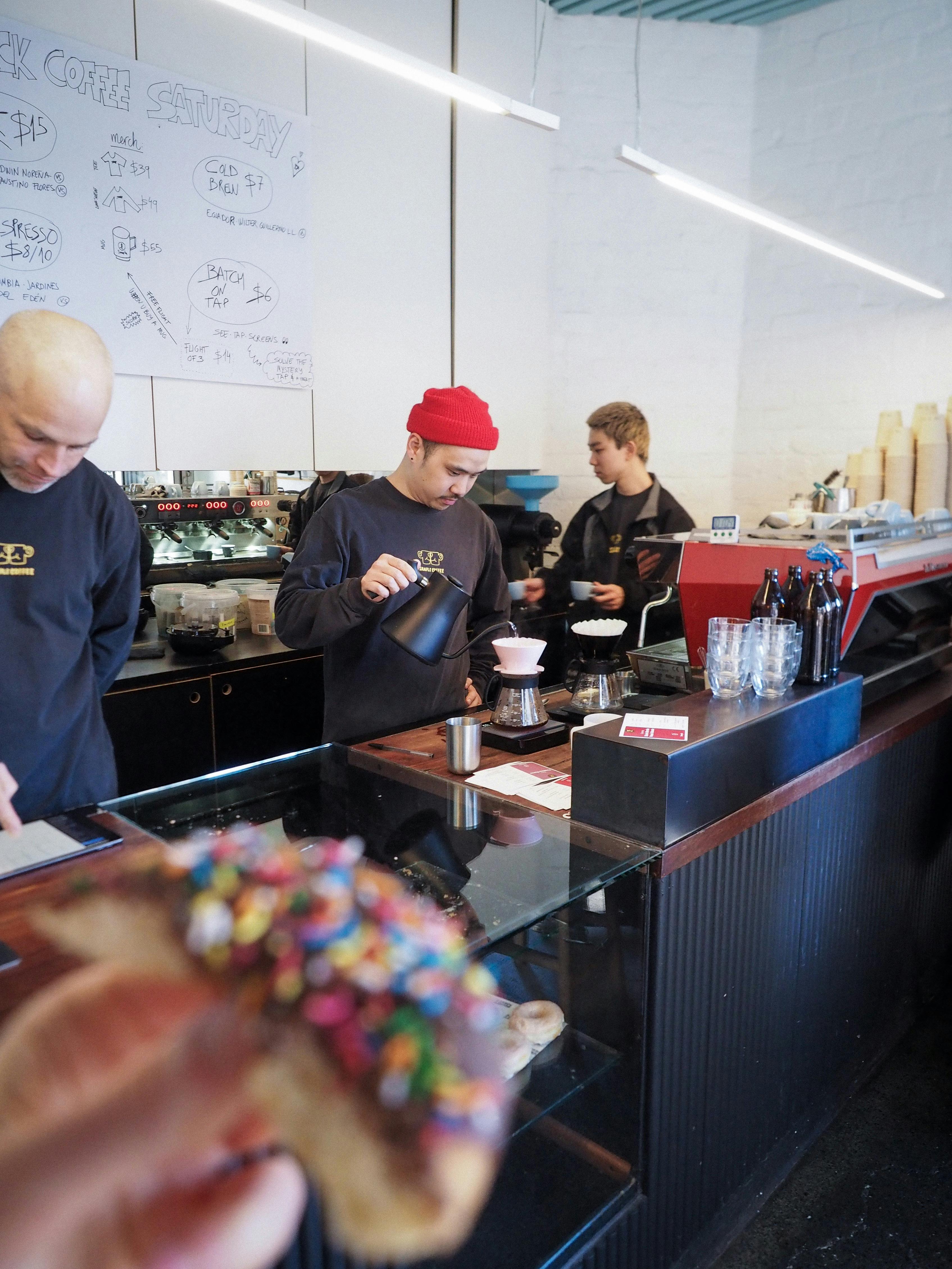 Staff brewing pour over coffee in Sample Coffee Surry Hills.