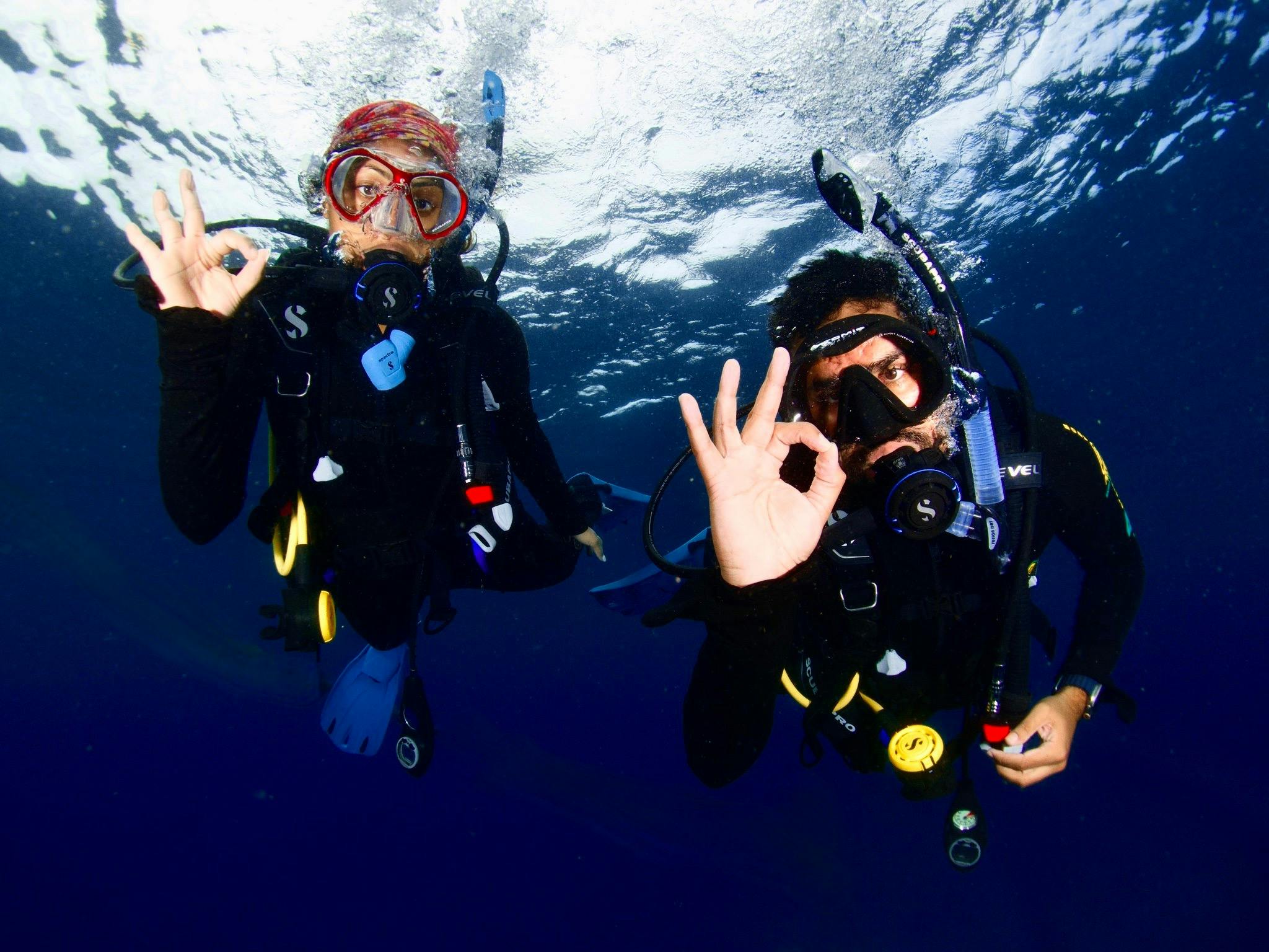 Happy Divers letting their guide know they are "ok" Happy Divers letting their guide know they are "ok"