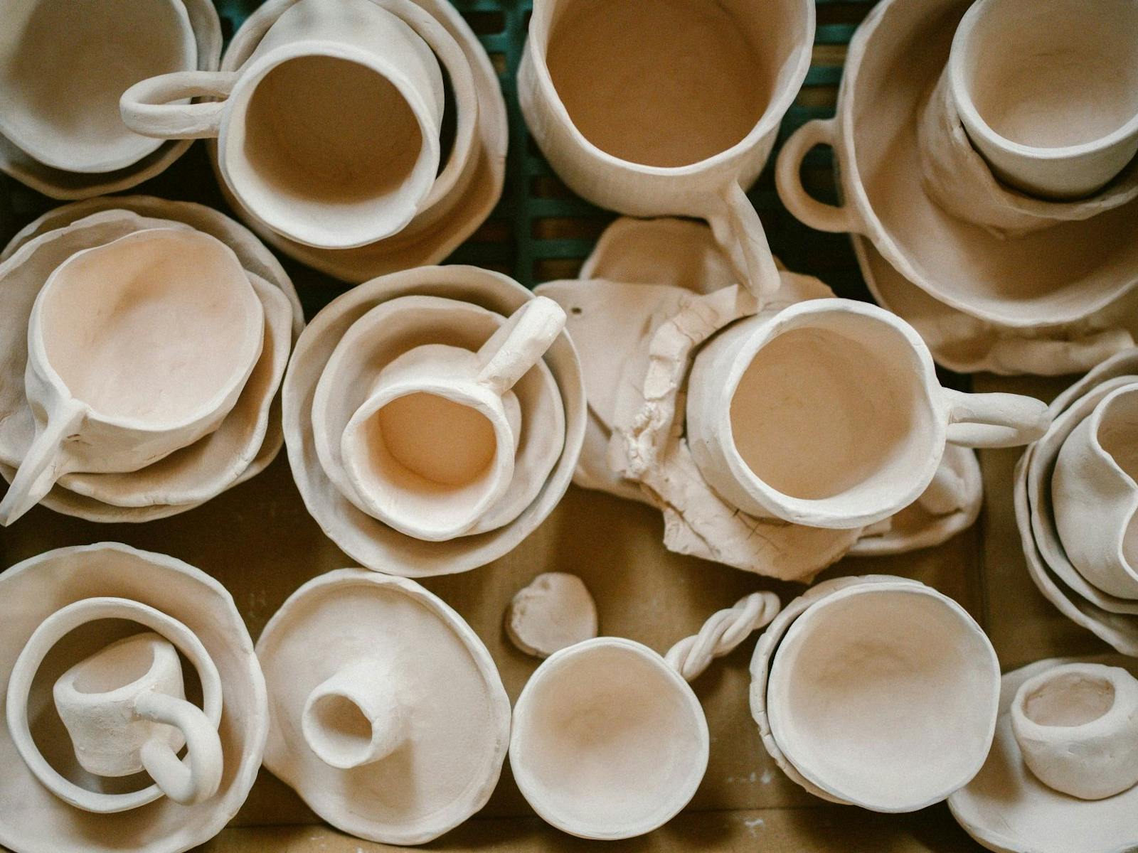 Various pottery mugs and sauces