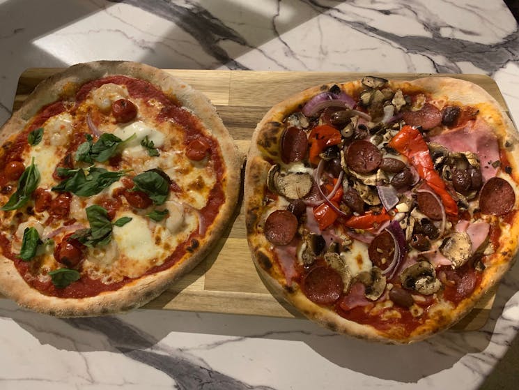 Our specialty pizzas just before they were descended upon by hungry customers