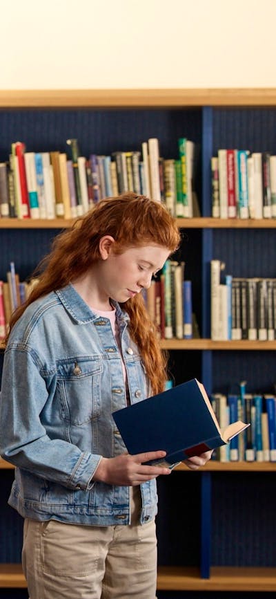 Visitors looking through books at the Charles Bean Research Centre
