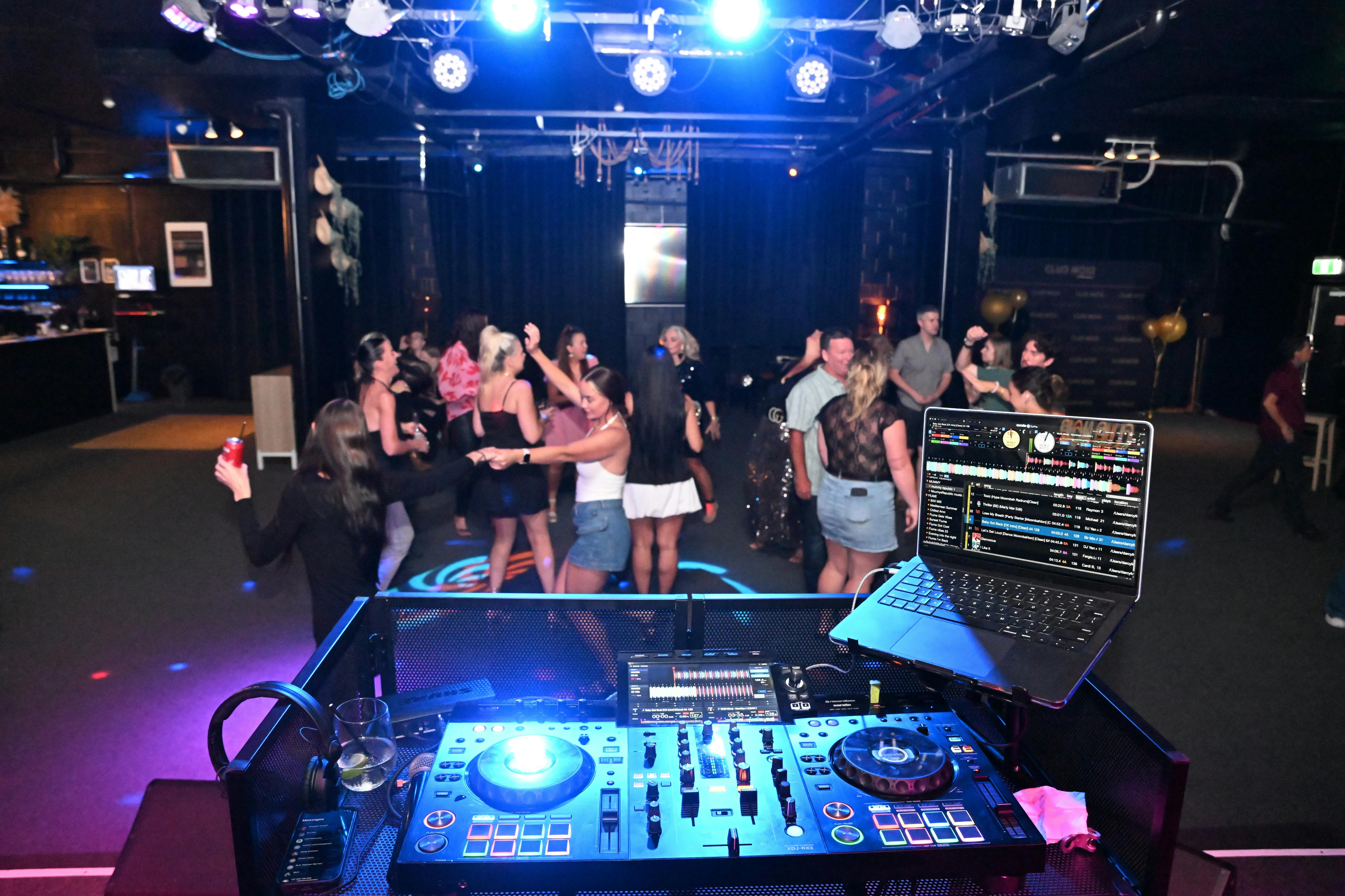 Bright lights shine on a full dancefloor on Club Noir's Night Club Night