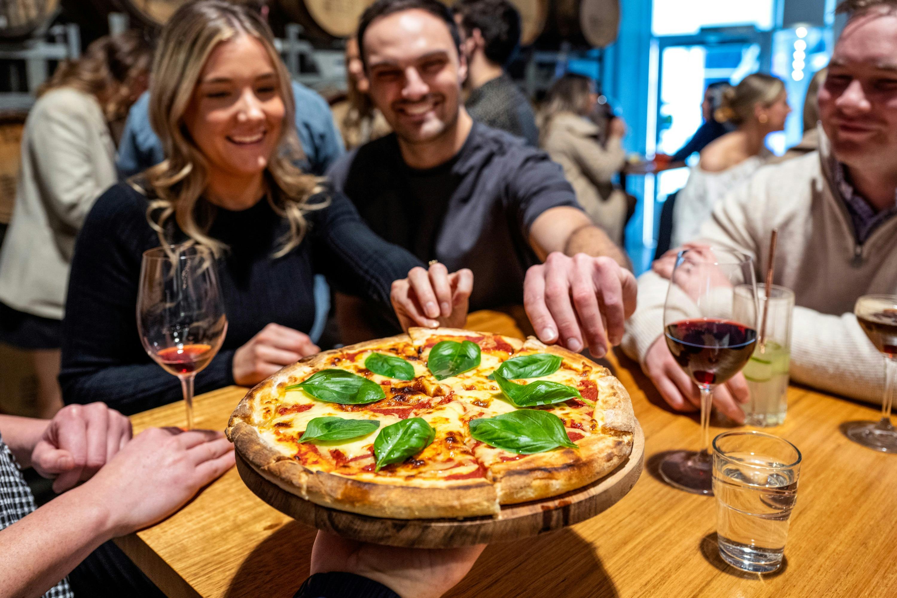 People eating cheese pizza