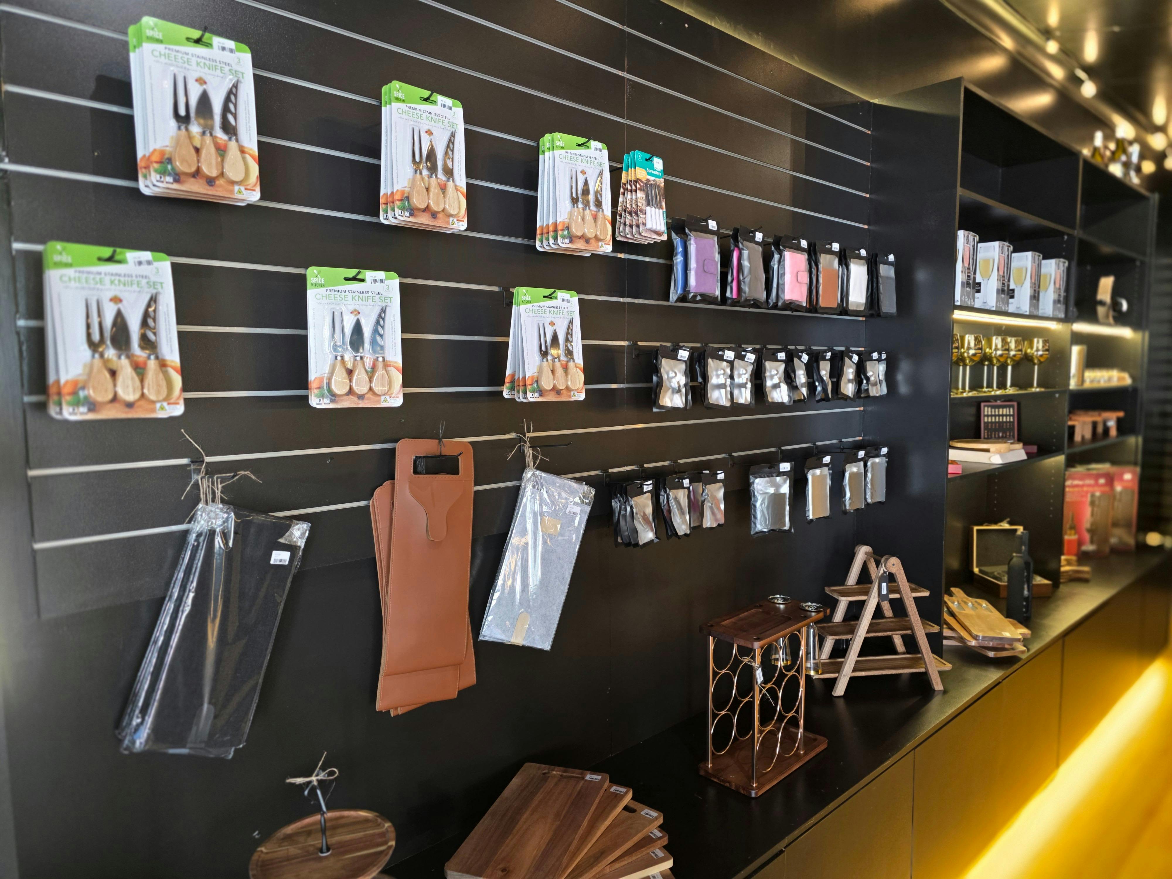 Inside The Gift Cellar shop with shelves of wine and gift items.