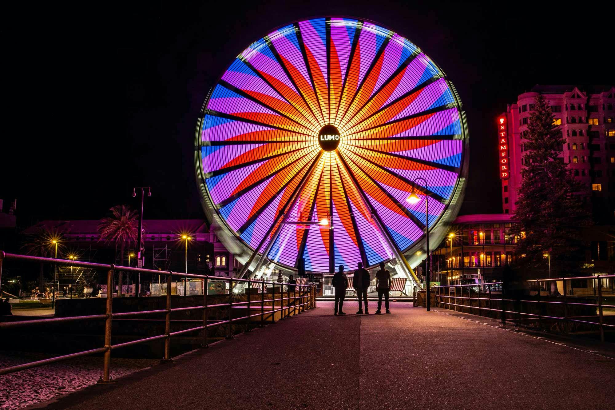 Capture the lights of the ferris wheel in Adventure Art Photography's Glenelg photography workshop.