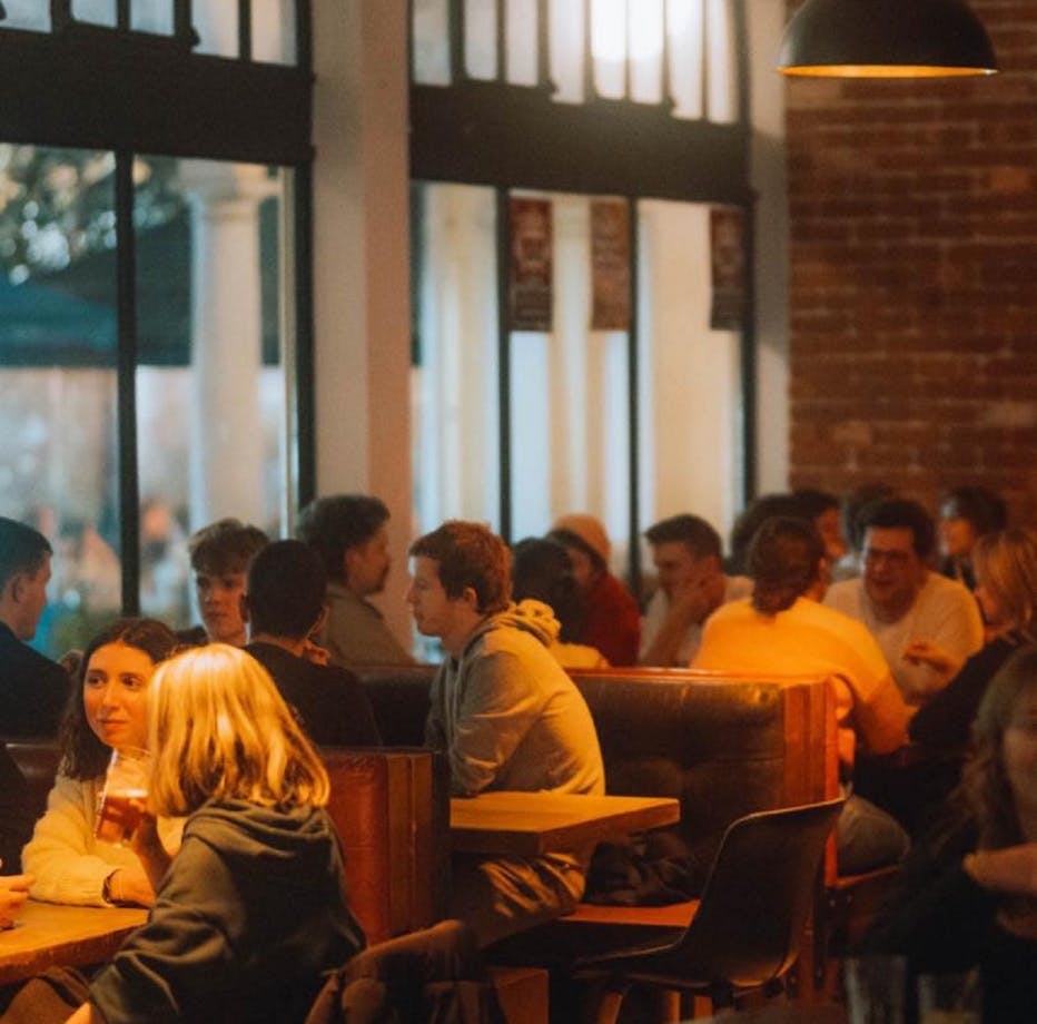 People sitting at tables talking