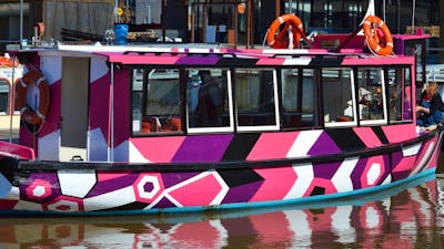Brightly coloured boat on the lake