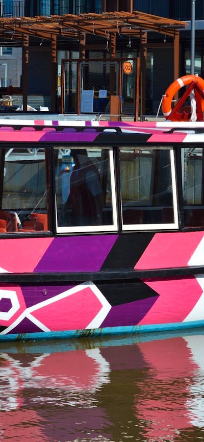Brightly coloured boat on the lake