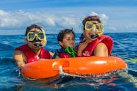 Family sorkeling on the Great Barrier Reef with Reef Experience friendly crew