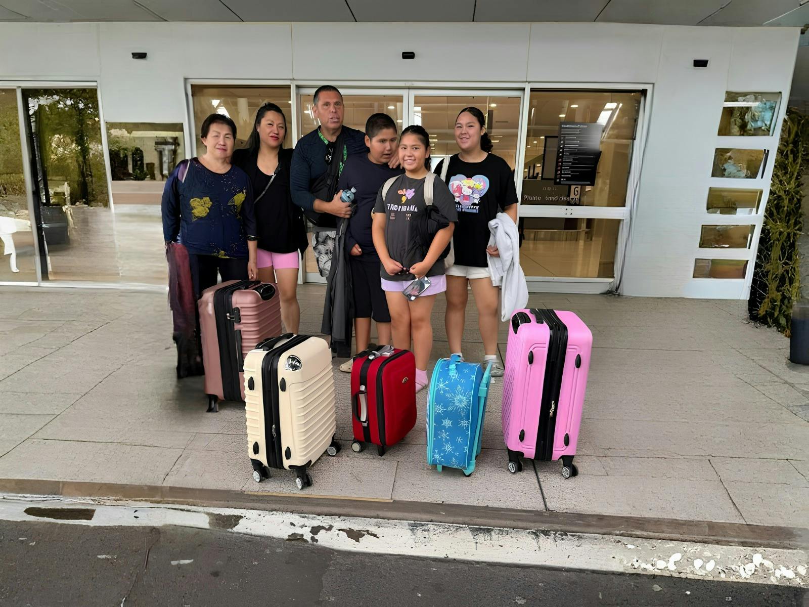 Family travellers using Fast Maxi transport service with luggage at Sydney Airport