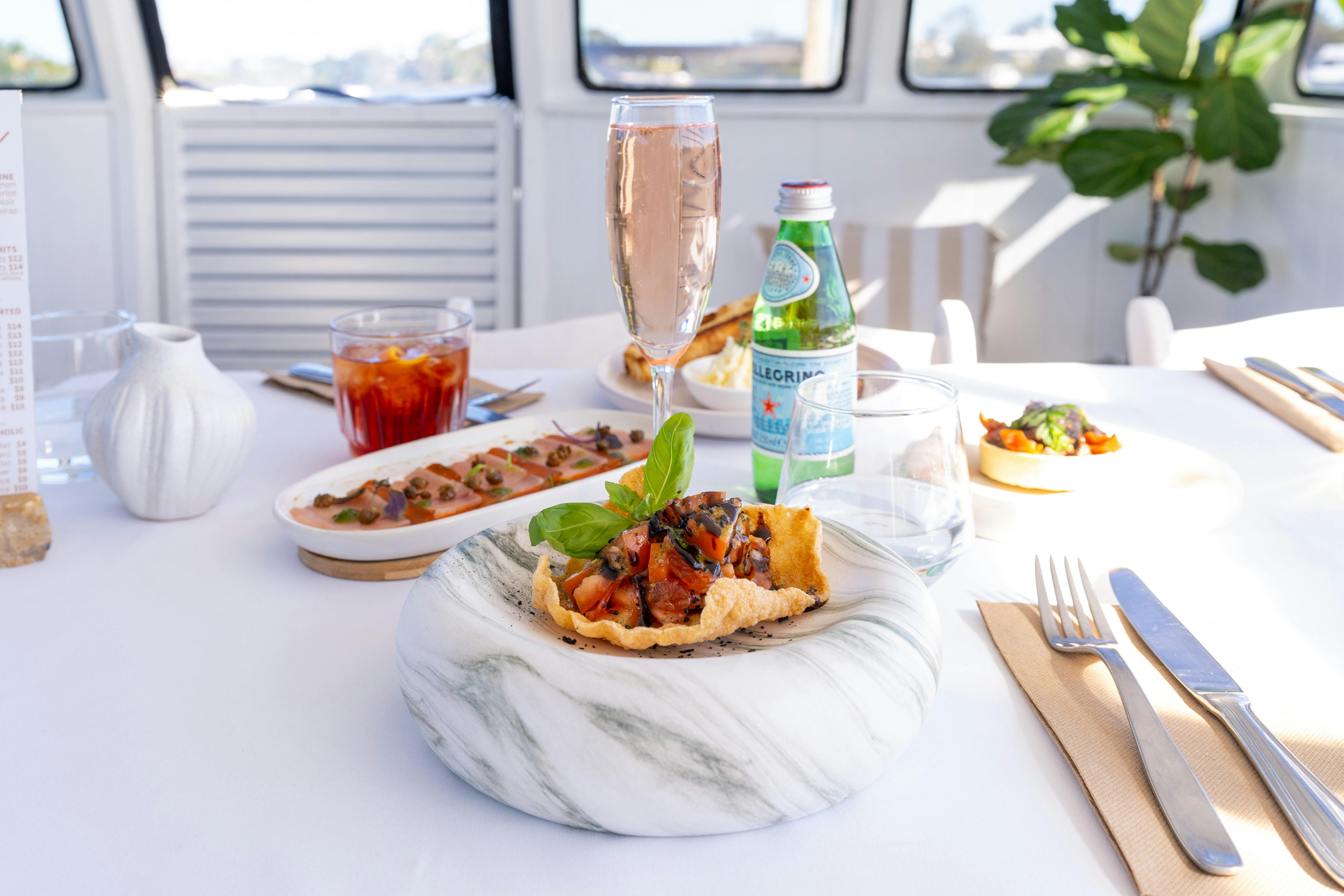 Cassava Bruschetta Crispy cassava cracker topped with Noosa seasonal tomatoes